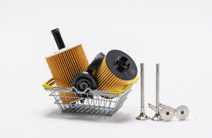 A collection of oil filters and appliance parts in a basket, used for repair services in Houston, TX.